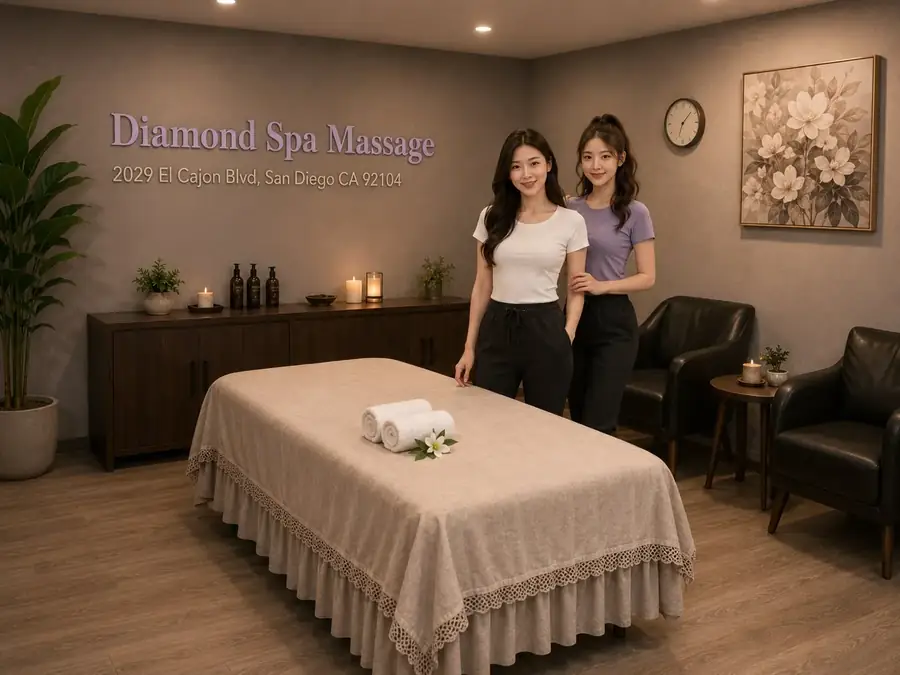 Two friendly massage therapists beside a clean treatment table at Diamond Spa Massage in San Diego CA